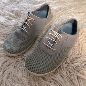 A pair of light gray shoes